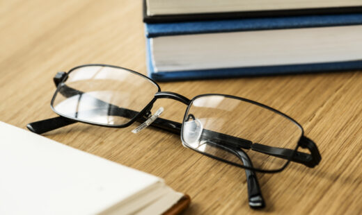 A pair of glasses and books educational, academic and literary concept